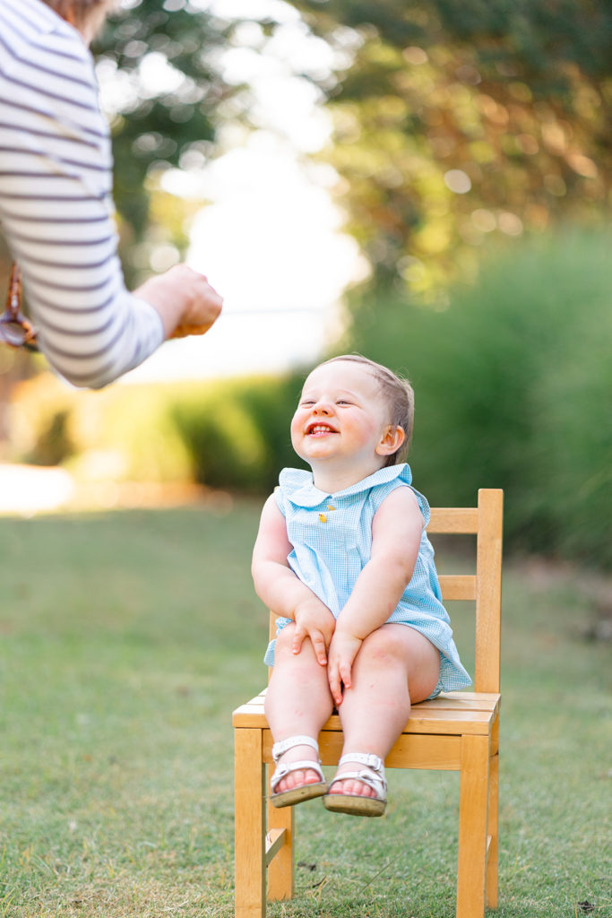Grandmother getting toddler to smile during Chattanooga photoshoot. 