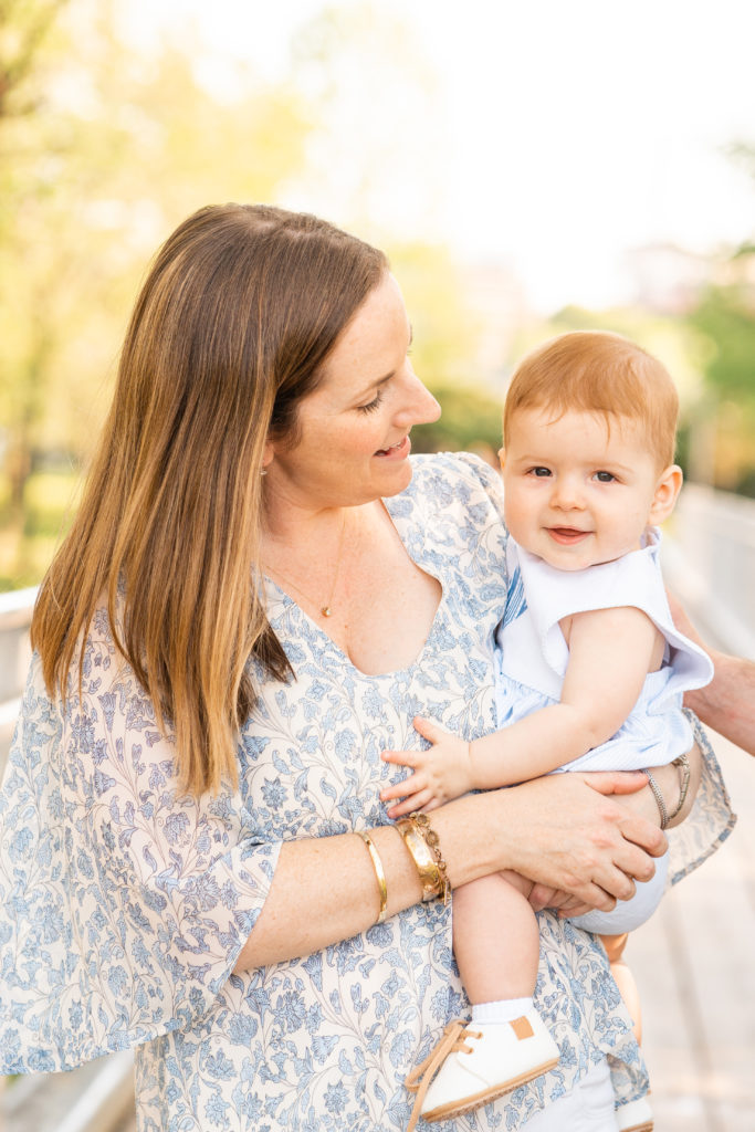 Chattanooga Family Photographer; 6 month milestone photos at Renaissance Park Chattanooga, TN - golden hour photography - Photo shoot outfits white and blue - Mom and baby - flying baby