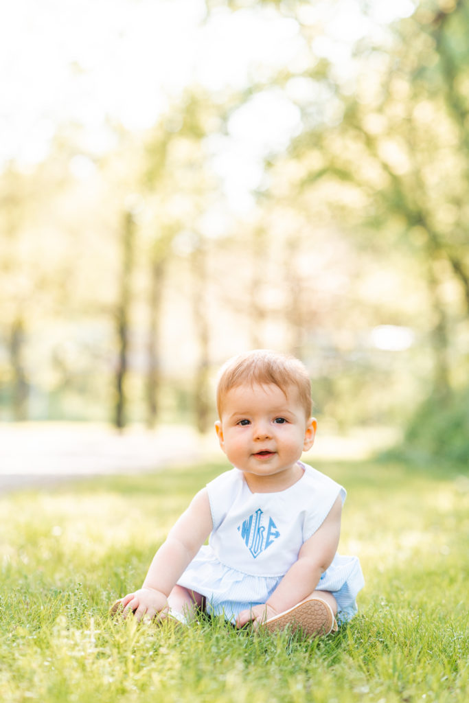 Chattanooga Family Photographer; 6 month milestone photos at Renaissance Park Chattanooga, TN - golden hour photography - Photo shoot outfits white and blue - Baby boy sitting pose