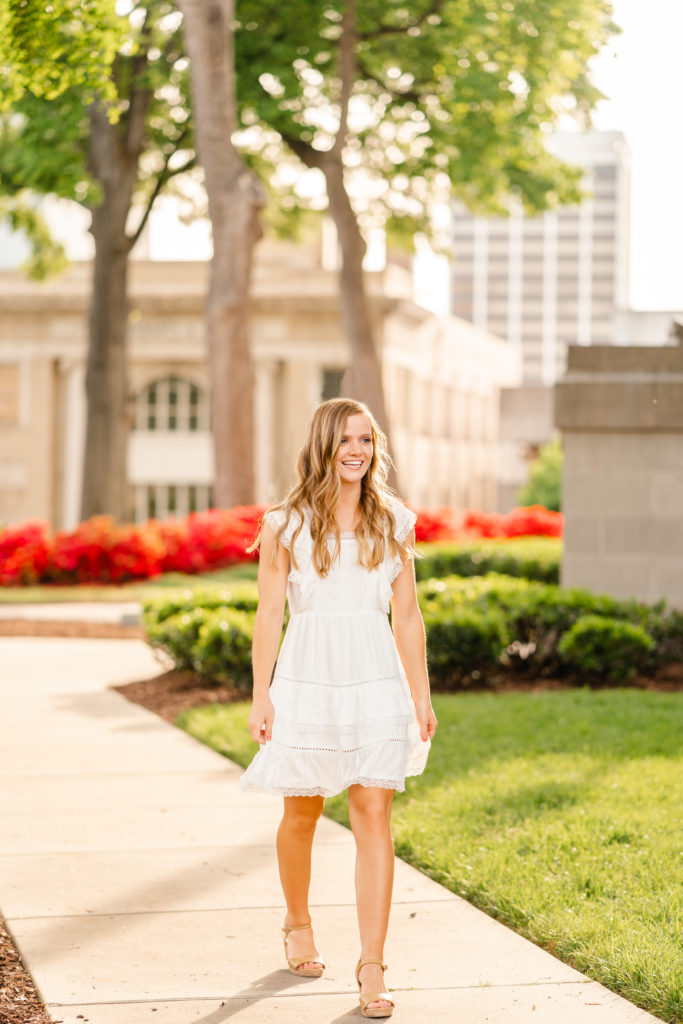 Lookout Mountain senior photography.. Spring Senior session in urban downtown Chattanooga location with blooming azaleas. Senior girl walking pose.