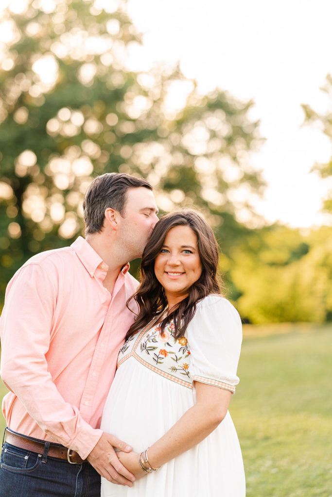 Chattanooga maternity photographer, Chattanooga photo spot Greenway Farms, couple posing, kissing cheek