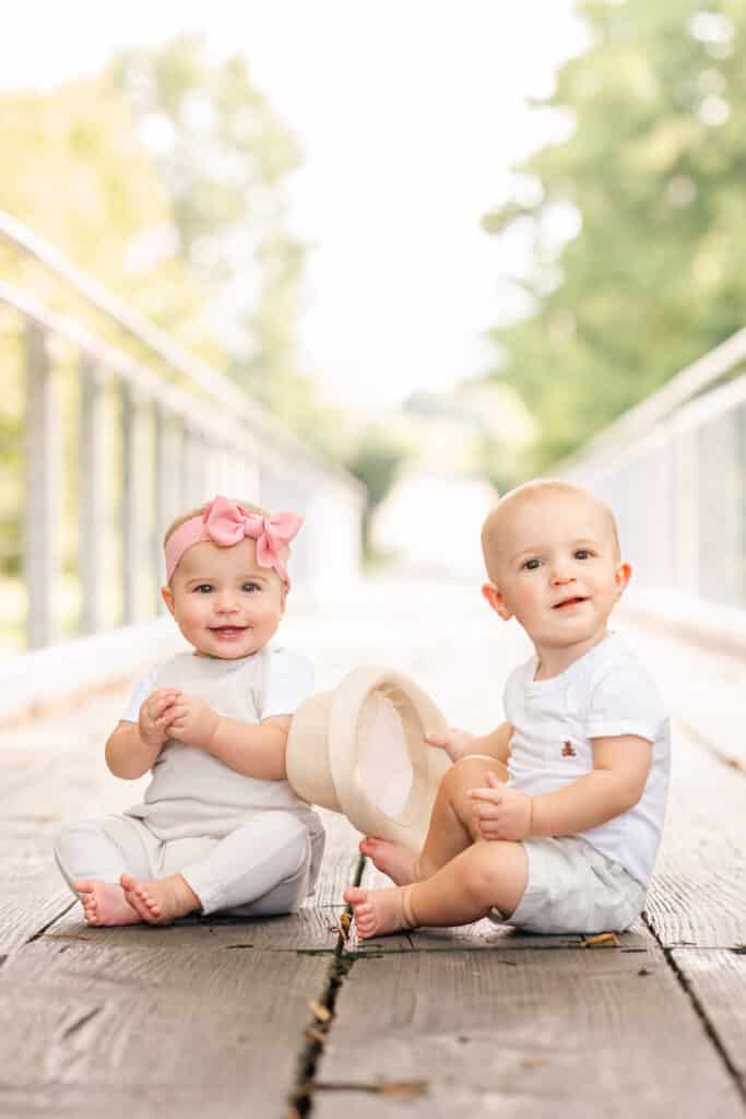 Twins smiling during session at free family photo spot in Chattanooga.