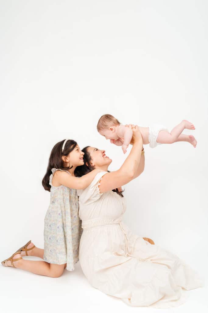 Motherhood photography with white backdrop