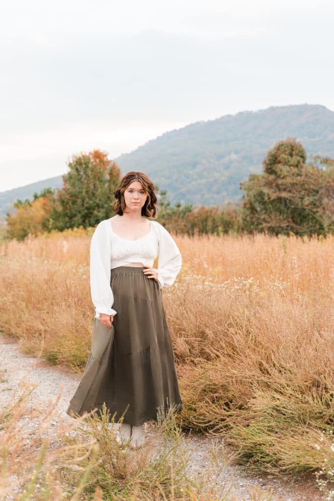 Teenager in field with Lookout Mountain in the background