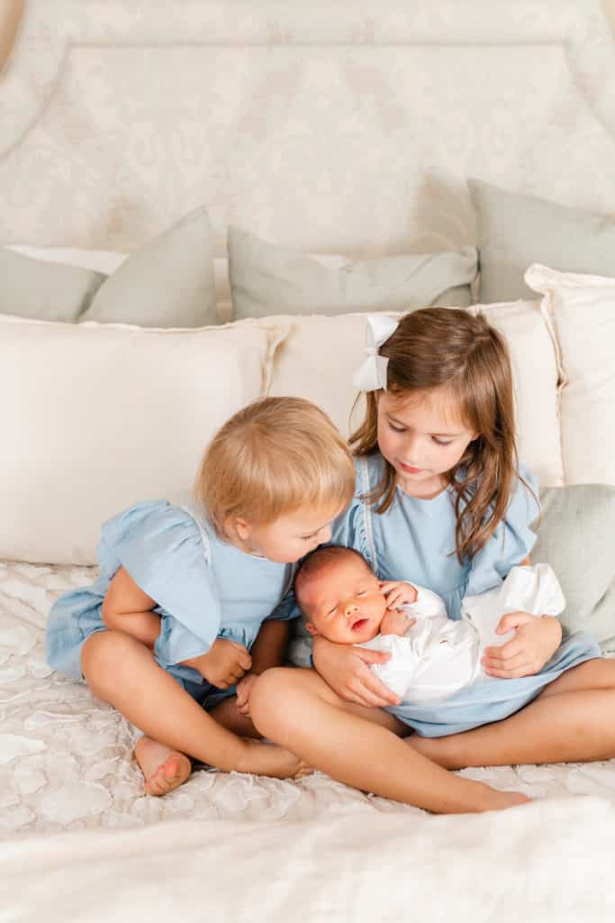 Light and airy photography, big sisters with baby brother