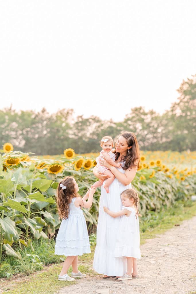 Mother with daughters in sunflower field, ooltewah TN
