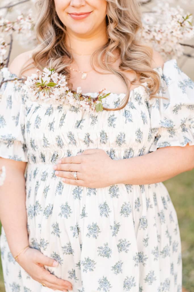 Mother during maternity session in floral dress