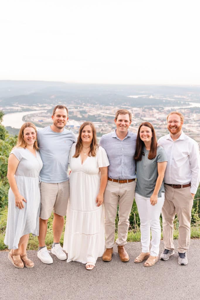 Adult siblings posing during family session at Point Park Lookout Mountain