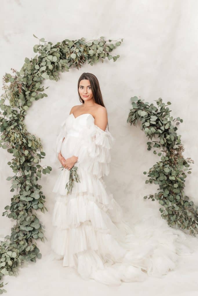 Luxury Chattanooga maternity photographer Kelley Hoagland shares an image of an expecting mother in a luxury white tulle dress.