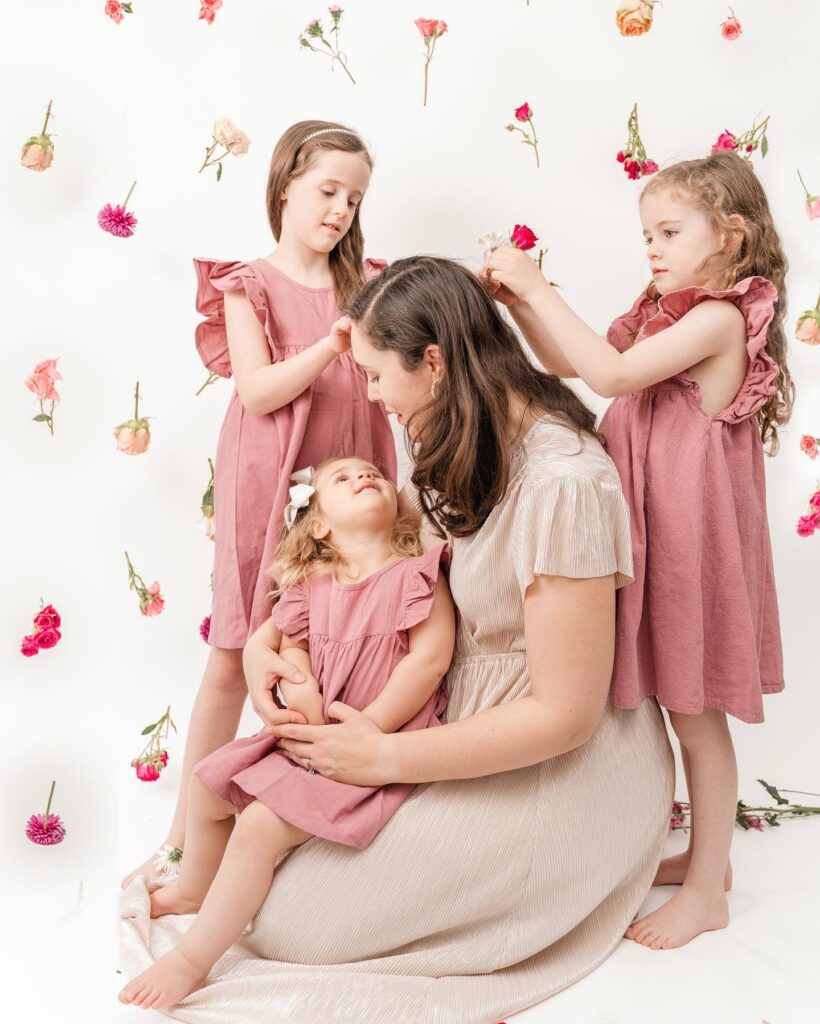 hanging flowers in front of backdrop