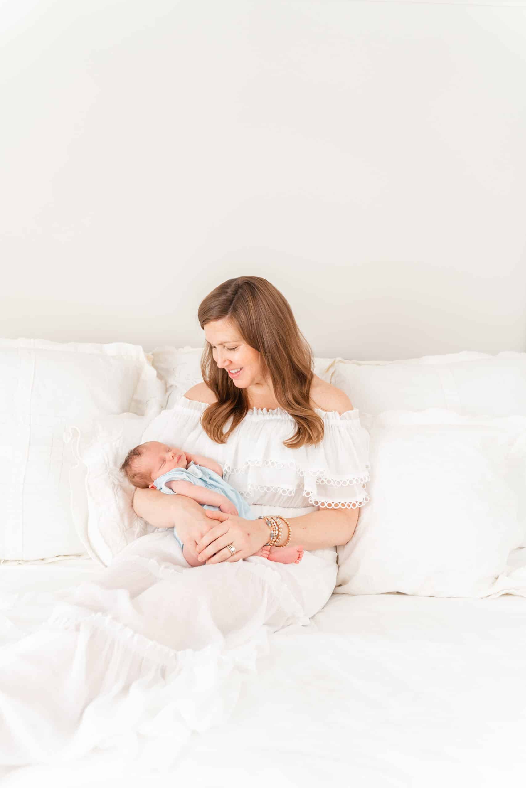 Tips for how to take light and airy indoor photos. Image of in-home newborn session with Godox Flash