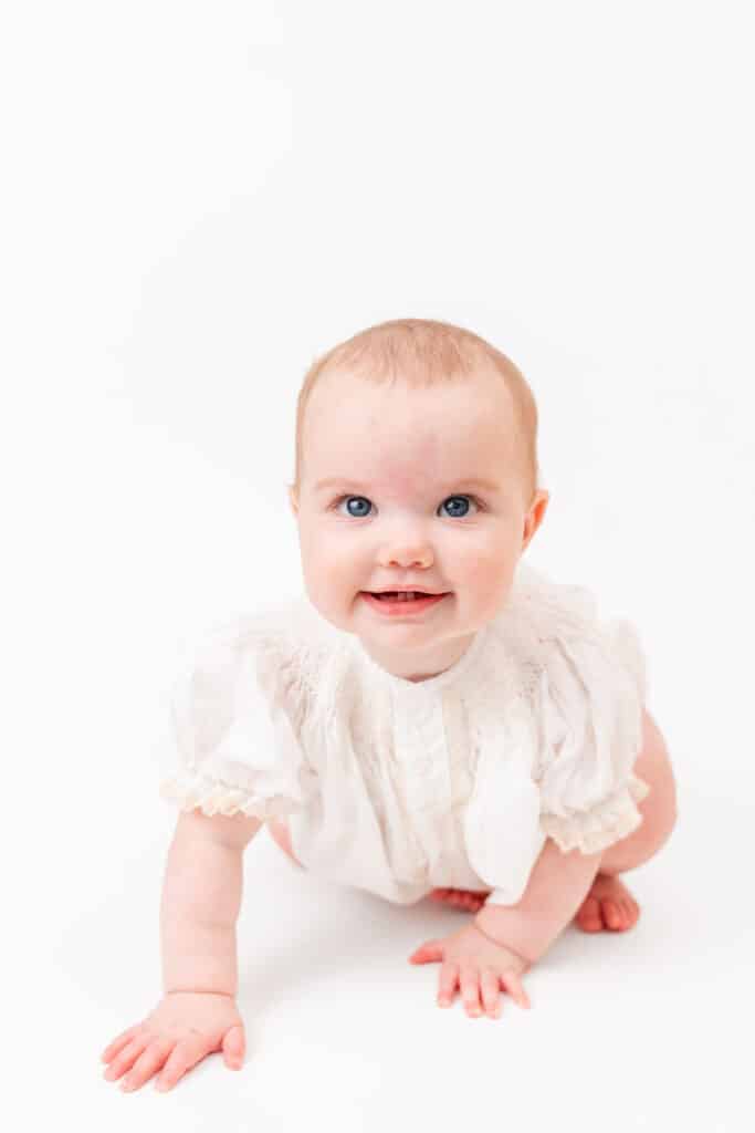Photography portrait of 9 month old in front of white backdrop
