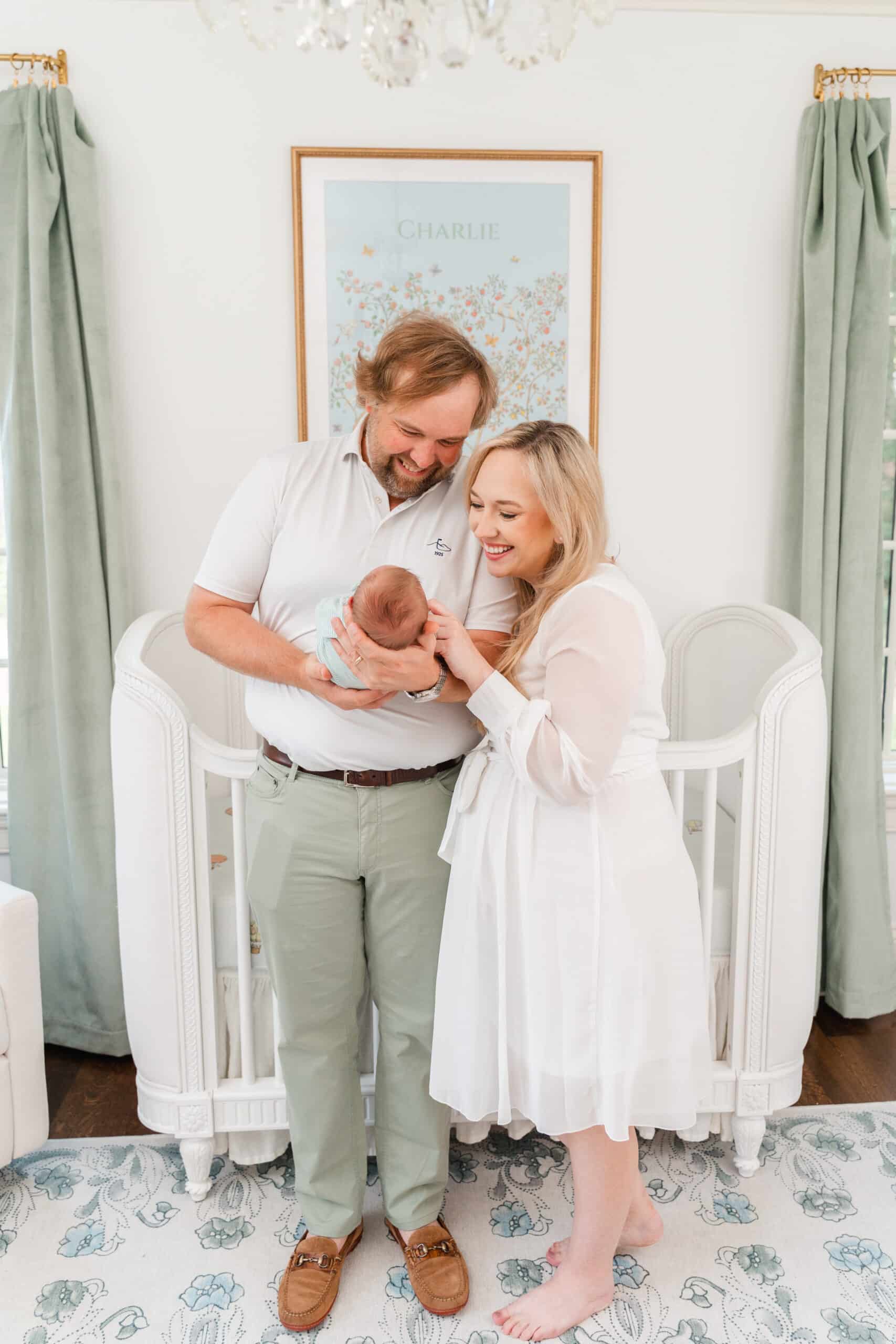 How to find a photographer. Images of couple with newborn in french country nursery. Maternity and newborn photo packages