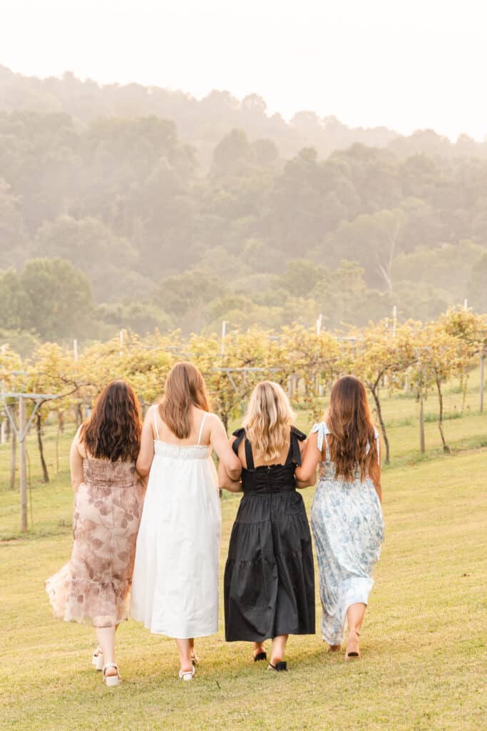 Models walking in romantic dresses from Chattanooga boutique walking at CloudTree Vineyard wedding venue