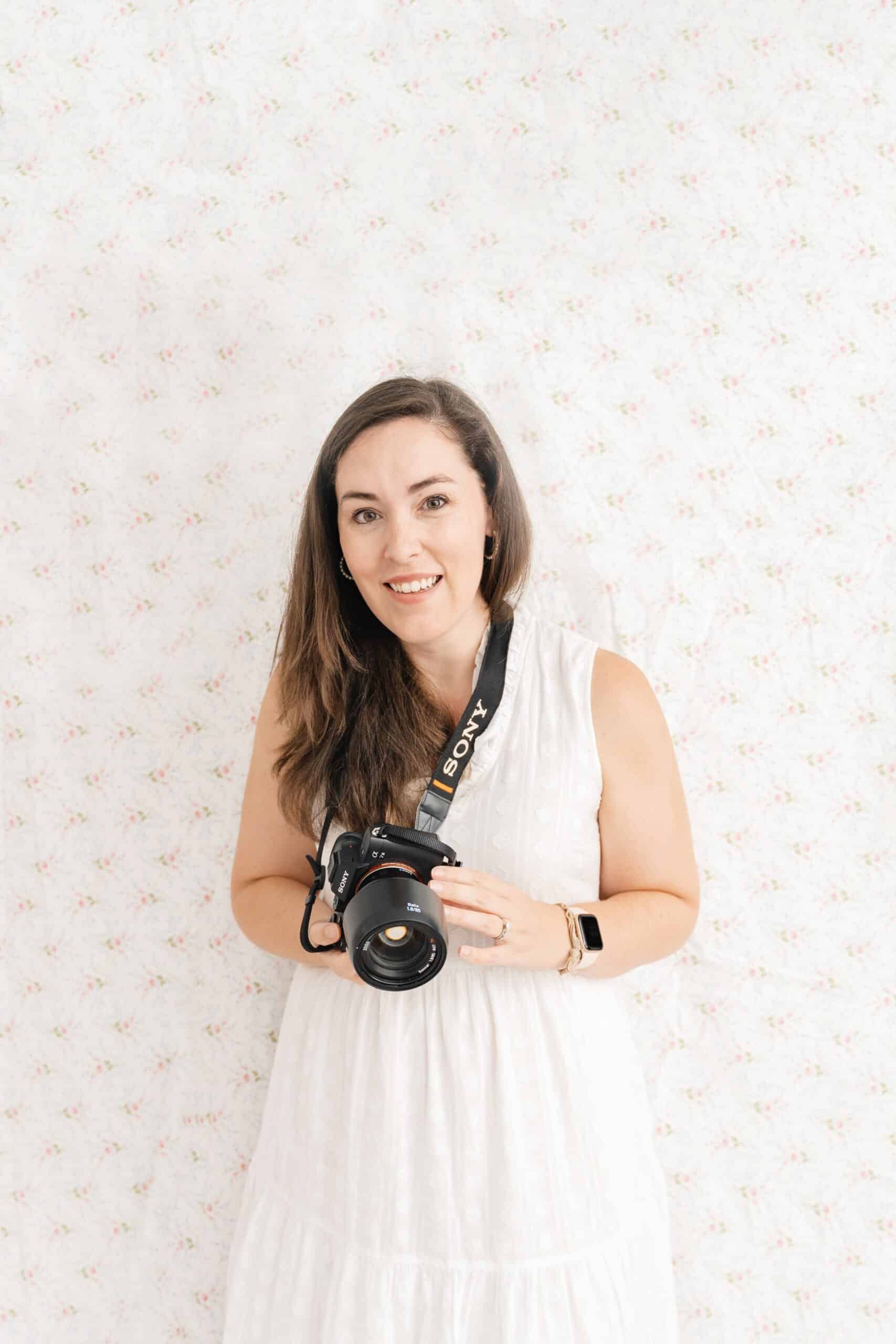 Chattanooga brand photographer Kelley Hoagland holds camera