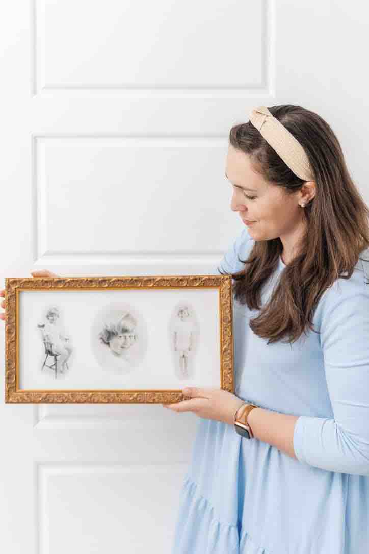 Kelley holds heirloom portrait created with Photoshop.