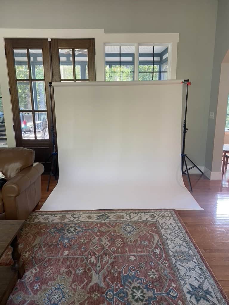 How to take heirloom portraits behind the scenes image of white backdrop on stand. 