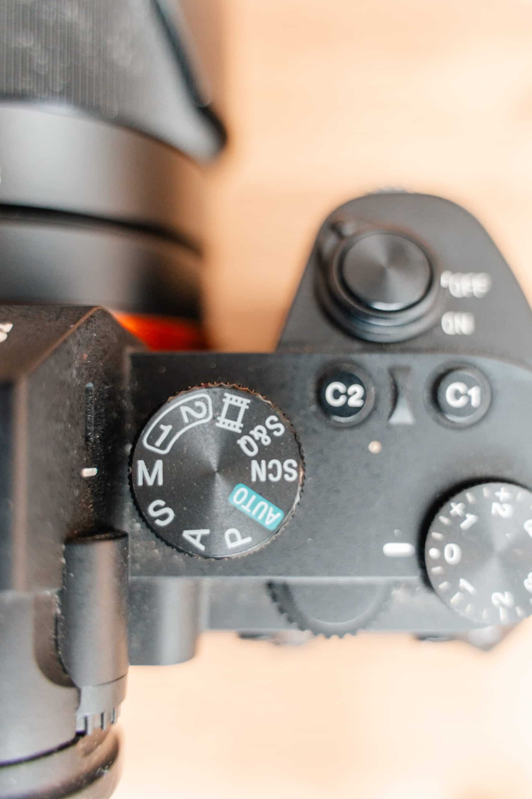 Image of camera mode dial on Sony a7iv.